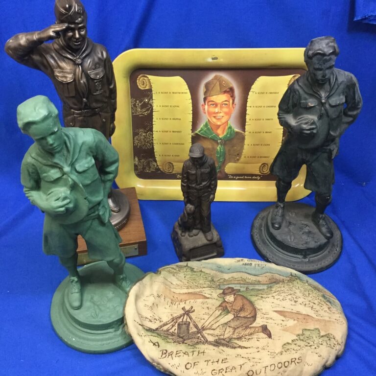 Boy Scout memorabilia collection — vintage statues and patches